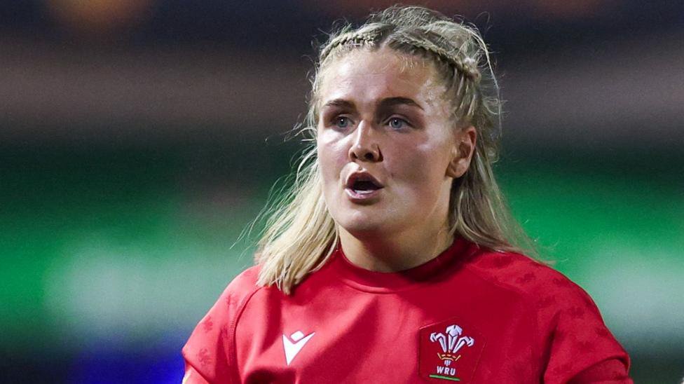 Alex Callender in Wales' red kit