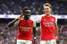 Bukayo Saka and Martin Odegaard of Arsenal celebrate after an own goal by Pierre-Emile Hojbjerg