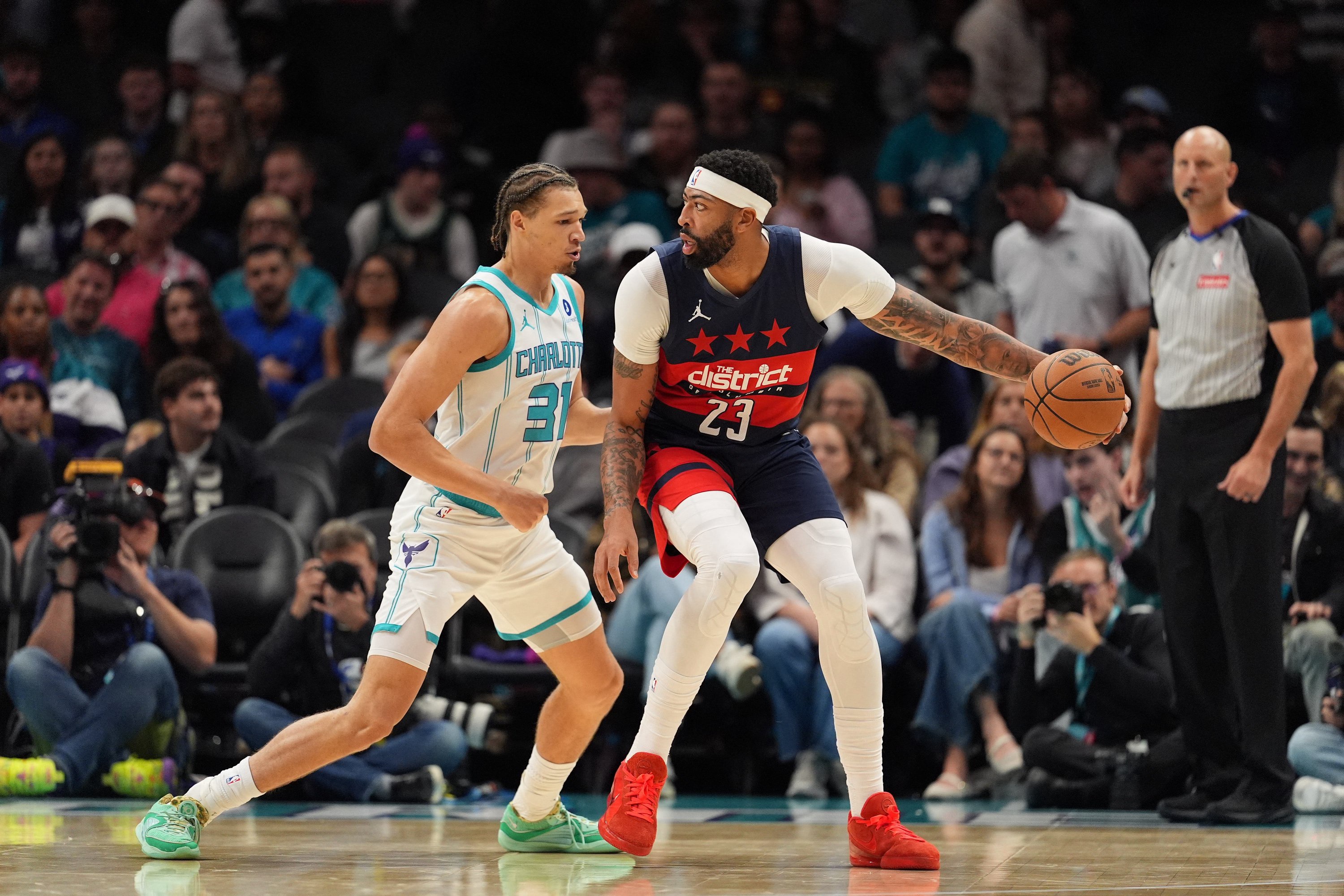 Oct 26, 2026; Charlotte, North Carolina, USA;  Washington Wizards forward Anthony Davis (23) handles the ball against Charlotte Hornets forward Tidjane Salaun (31) during the first half at the Spectrum Center.  Mandatory Credit: Jim Dedmon-Imagn Images