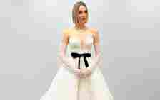 Wedding dress with applique, bow, corset details
