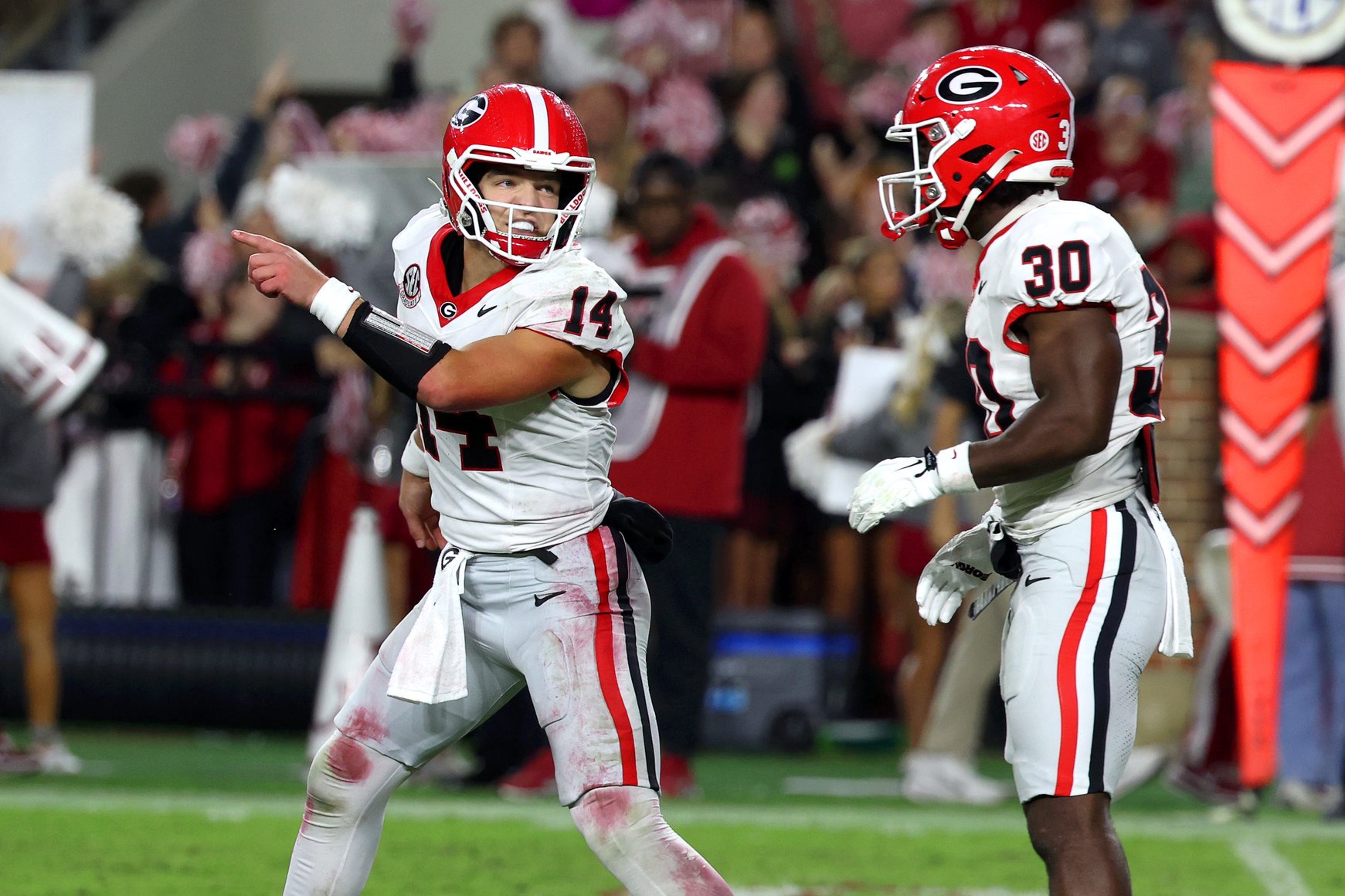 Oct 10, 2026; Tuscaloosa, Alabama, USA; Georgia Bulldogs quarterback Gunner Stockton (14) directs teammate running back Nick Peal (30) during the third quarter against the Alabama Crimson Tide at Saban Field at Bryant-Denny Stadium. Mandatory Credit: David Leong-Imagn Images