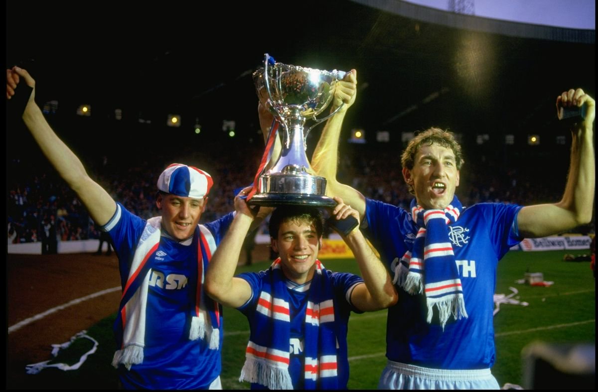 Terry Butcher (right) celebrates with the Skol Cup trophy after the final against Celtic.