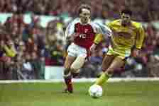 Arsenal had blue stripes on their shirt during the 1990/91 season 