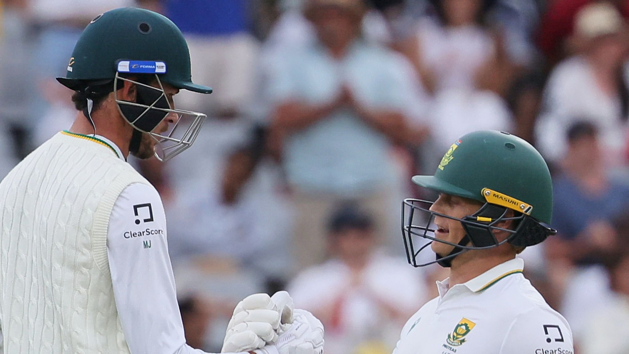 Marco Jansen, left, celebrates his fifty with teammate Ryan Rickelton on the opening day 