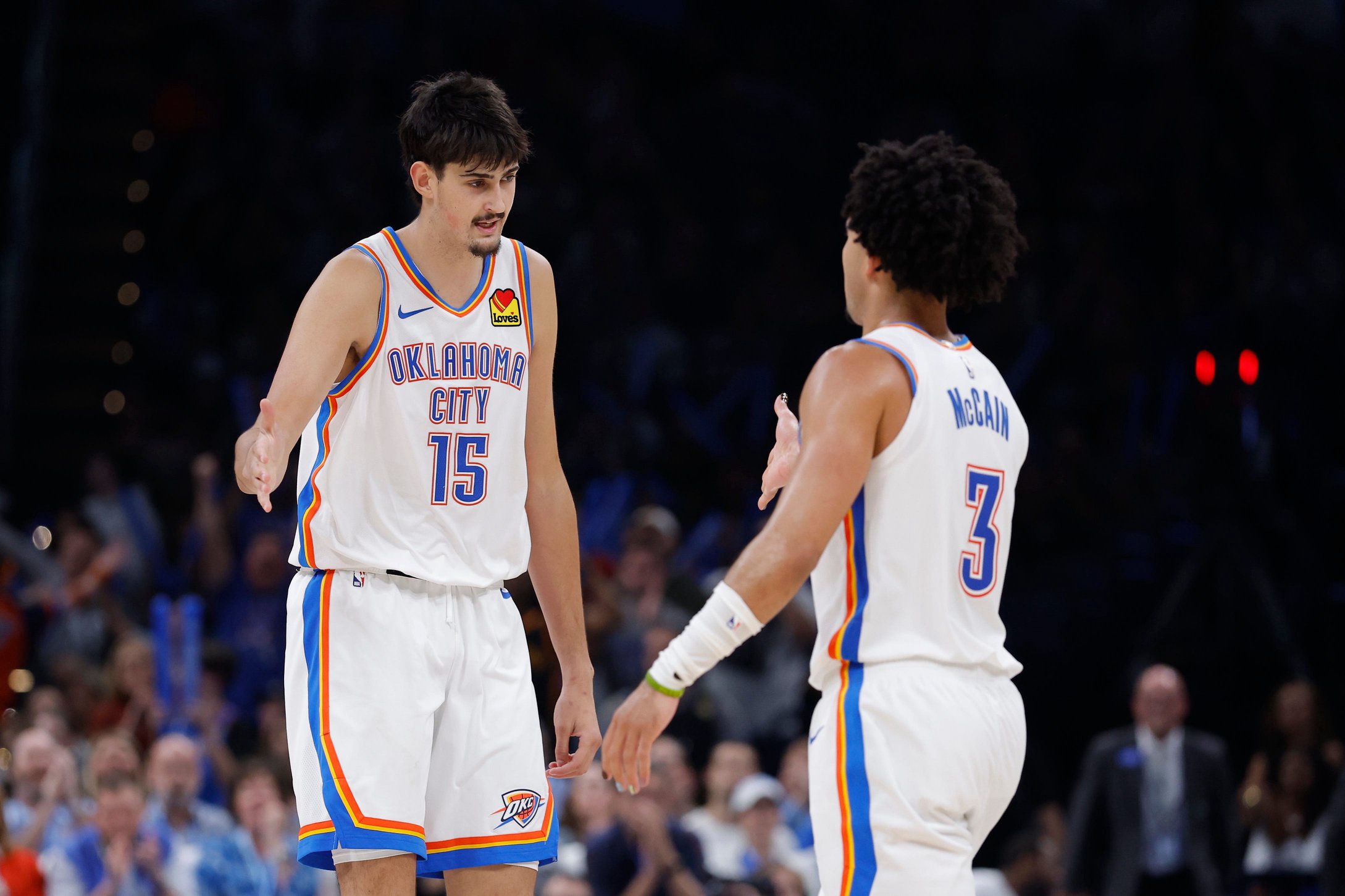 Oct 26, 2026; Oklahoma City, Oklahoma, USA; Oklahoma City Thunder center Aday Mara (15) and guard Jared McCain (3) celebrate after a play against the Phoenix Suns during the second half at Paycom Center. Mandatory Credit: Alonzo Adams-Imagn Images