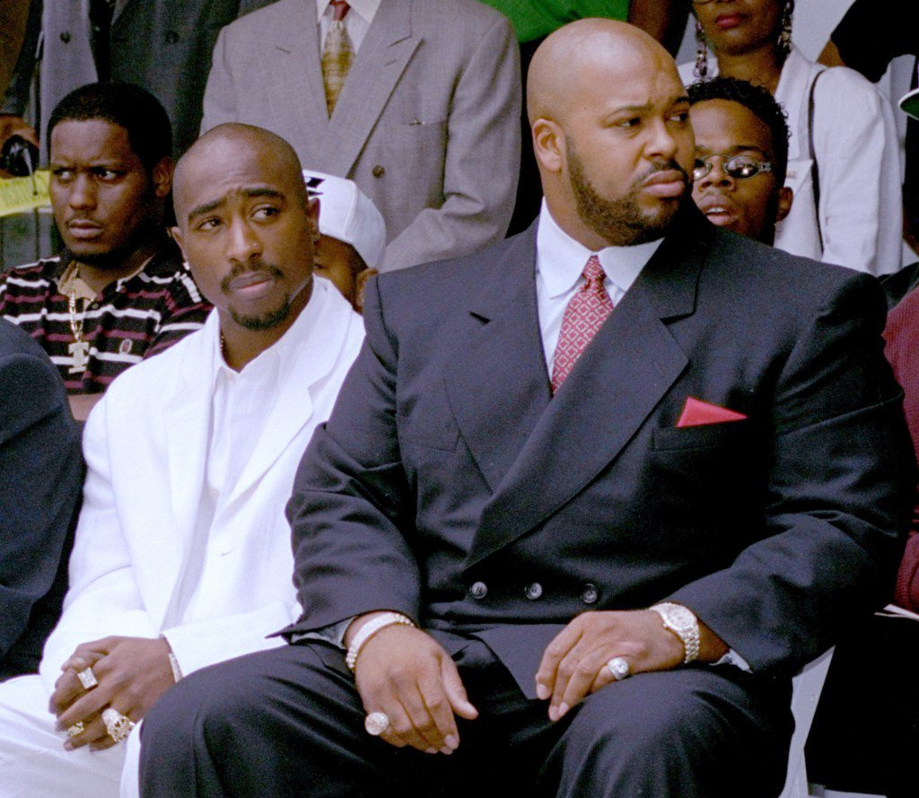 Knight with rapper Tupac Shakur (L) at an event in Los Angeleson Aug.15, 1996.