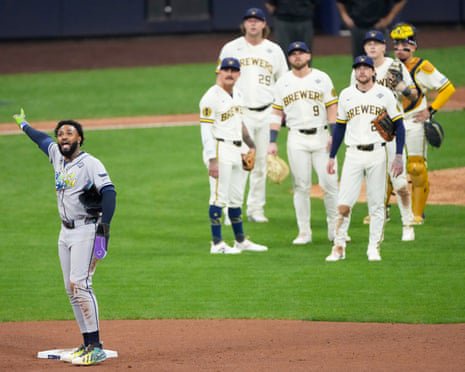 The Rays’ Junior Caminero celebrates after a call is overturned during the ninth inning of Friday’s World Series opener against the Brewers.