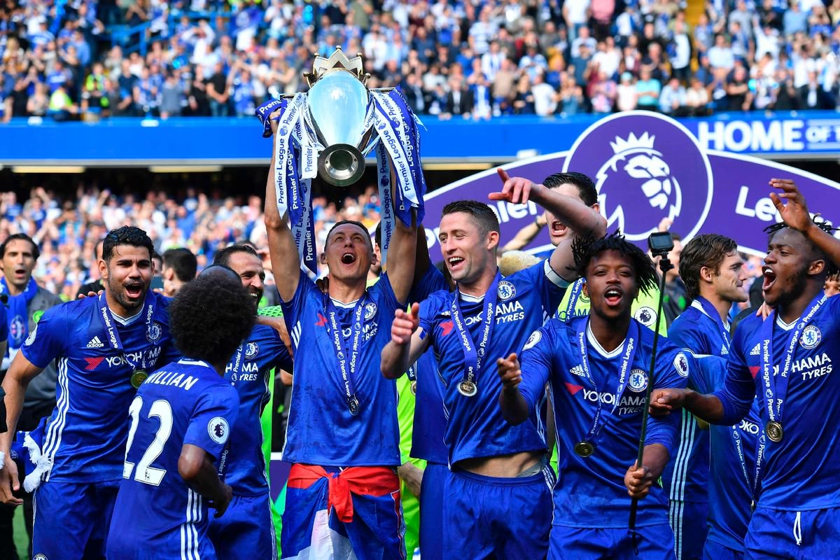 Chelsea's Serbian midfielder Nemanja Matic holds up the English Premier League trophy