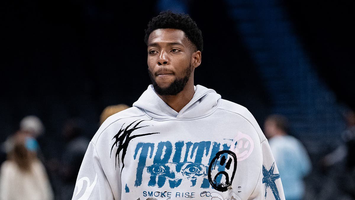 Brandon Miller of the Charlotte Hornets looks on after a preseason game.