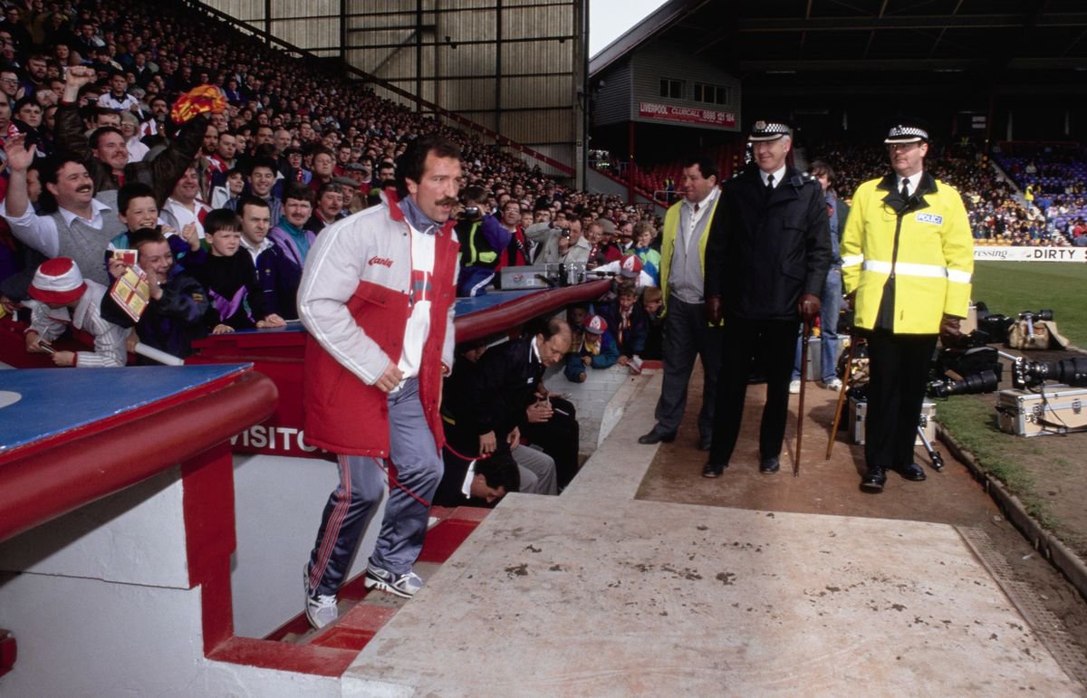 Graeme Souness emerges from the Tunnel as the Police and crowd look ahead of his first match in charge, a First Division match against Norwich City at Anfield on April 20th, 1991.