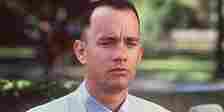 Forrest (Tom Hanks) on a bus bench in the opening scene of Forrest Gump 