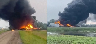 Train hauling hazardous material derails, catches fire in North Dakota