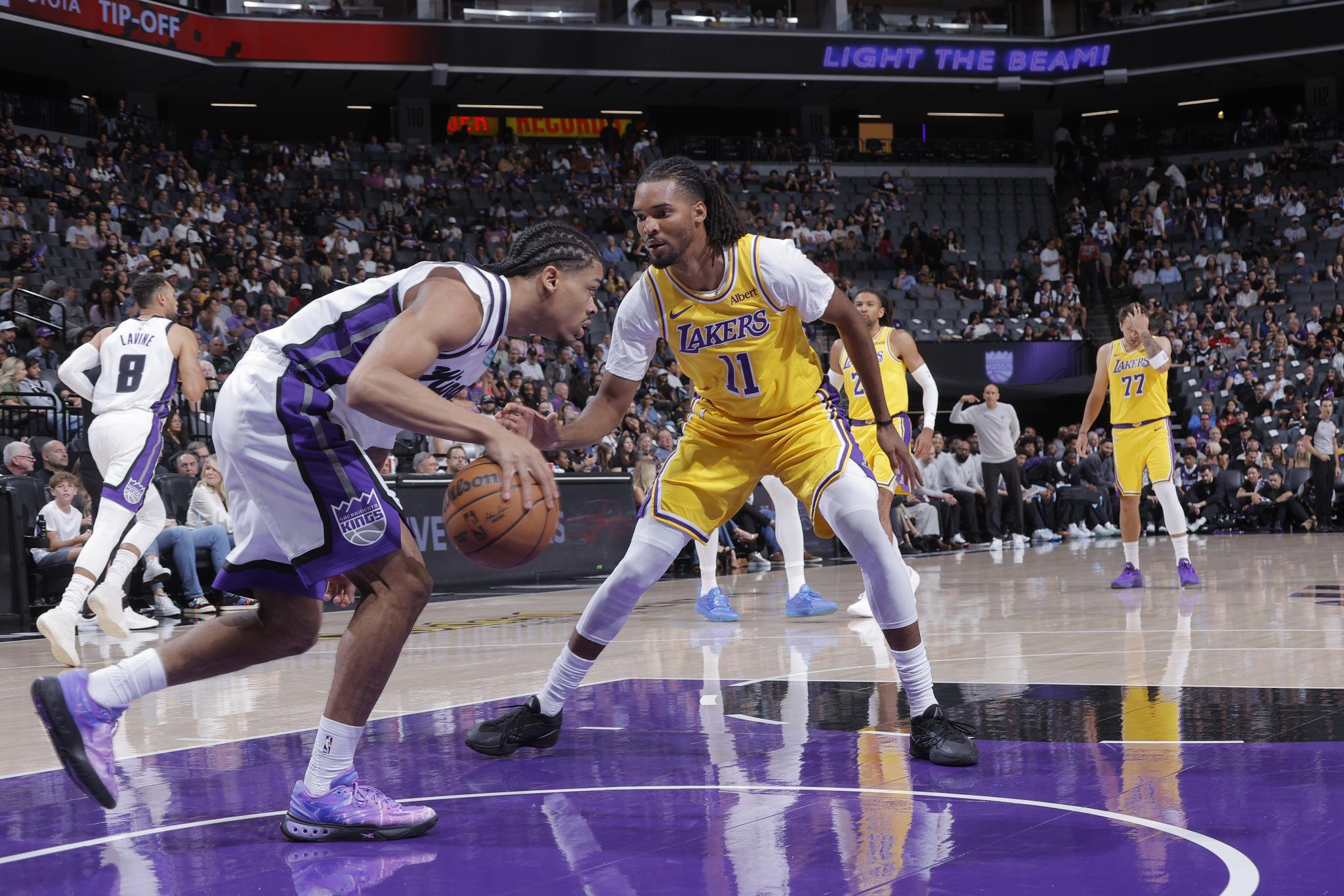 Ziaire Williams (11) of the Los Angeles Lakers plays defense against Darius Acuff Jr. (5) of the Sacramento Kings during an NBA preseason game at the Golden 1 Center in Sacramento, California, Monday, Oct. 5, 2026.