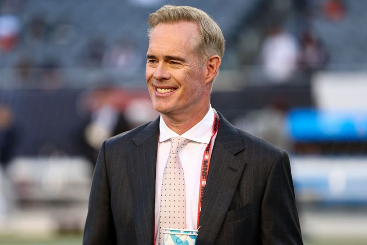 ESPN commentator Joe Buck stands on the field