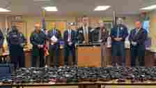 Law enforcement news conference with stolen guns