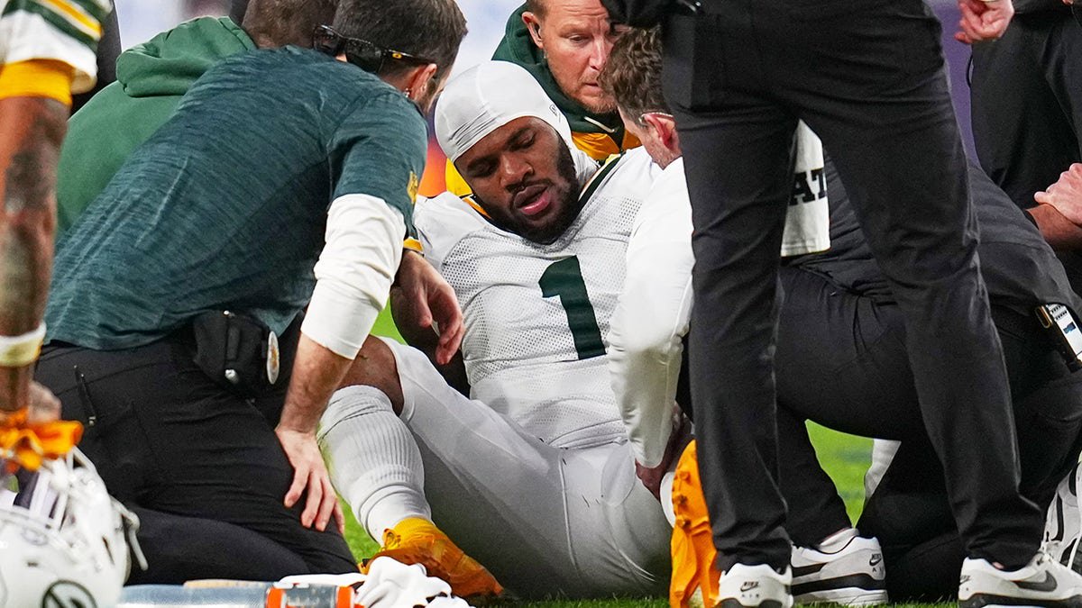 Micah Parsons being tended to on the field