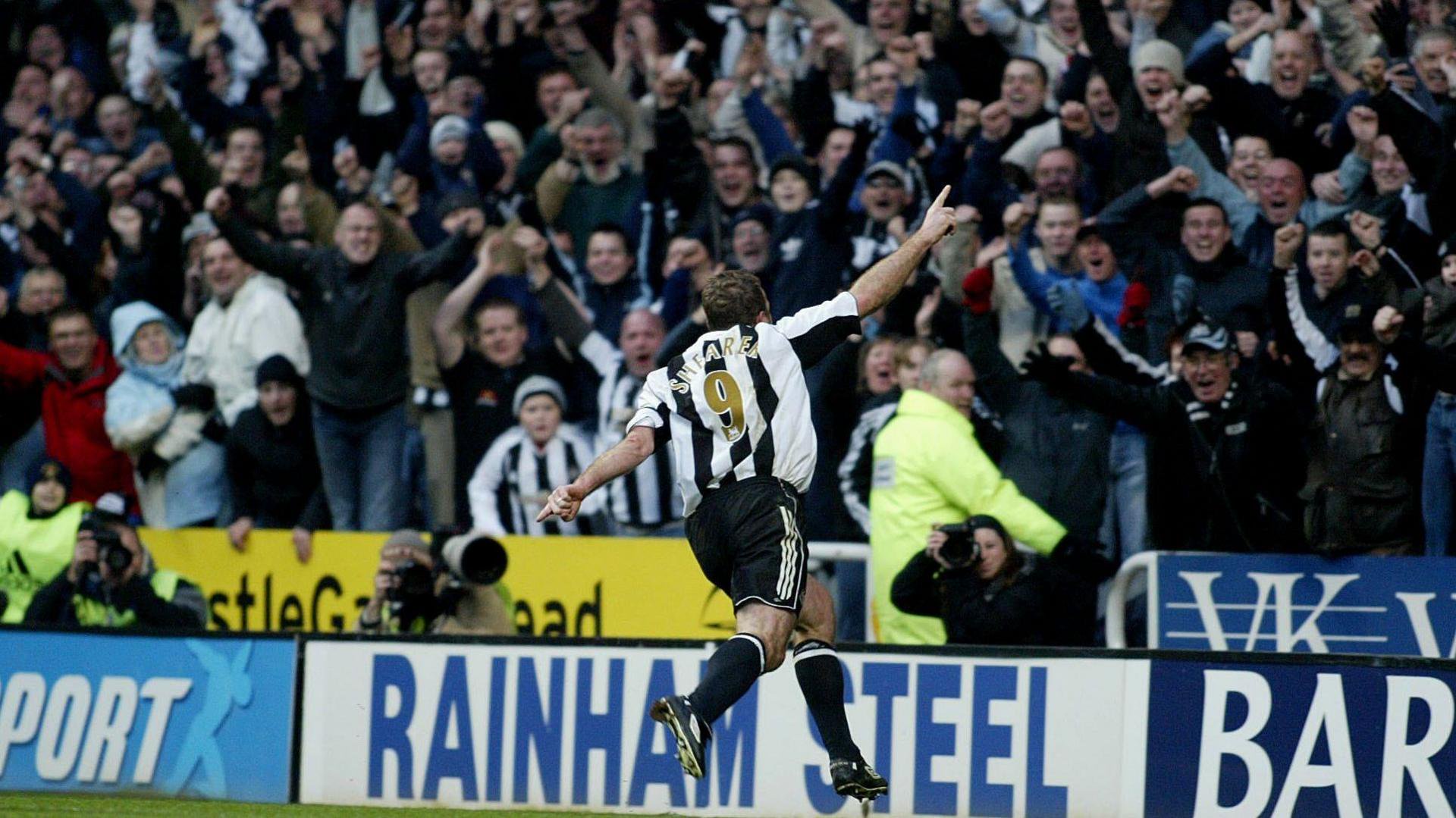 Alan Shearer celebrates scoring with Newcastle fans