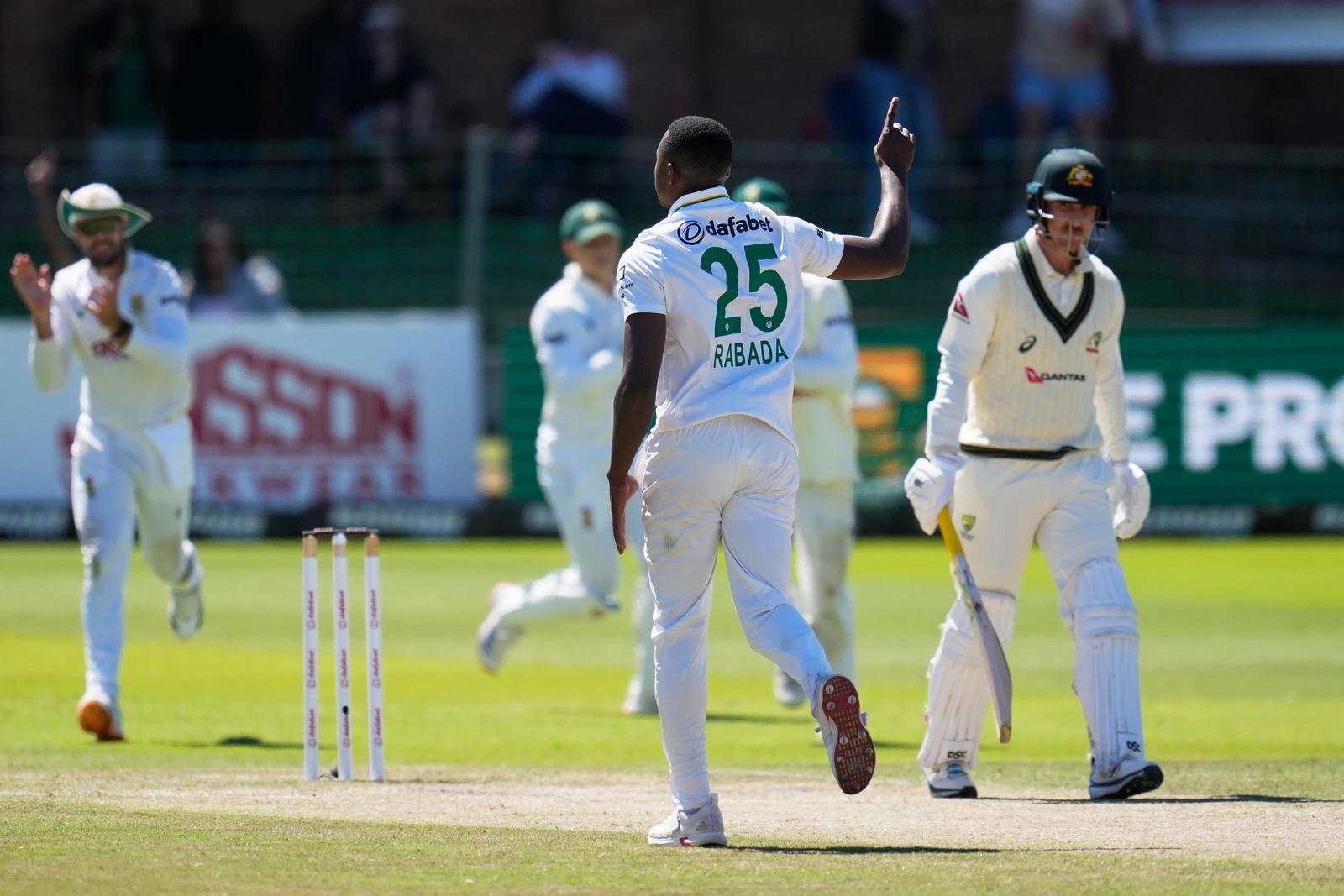 South Africa's Kagiso Rabada, center, celebrates the wicket of Australia's Nic Maddinson, right, on day four of the second cricket test match between South Africa and Australia, in Gqeberha, South Africa, Oct. 21, 2026. (AP)