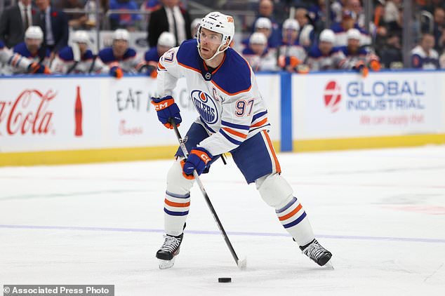 Edmonton Oilers' Connor McDavid (97) skates with the puck during the first period of an NHL hockey game against the New York Islanders, Saturday, Oct. 31, 2026, in Elmont, N.Y. (AP Photo/Pamela Smith)