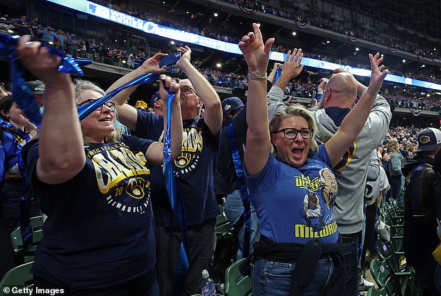 Back in Milwaukee, fans watched on the jumbotron at American Family Field