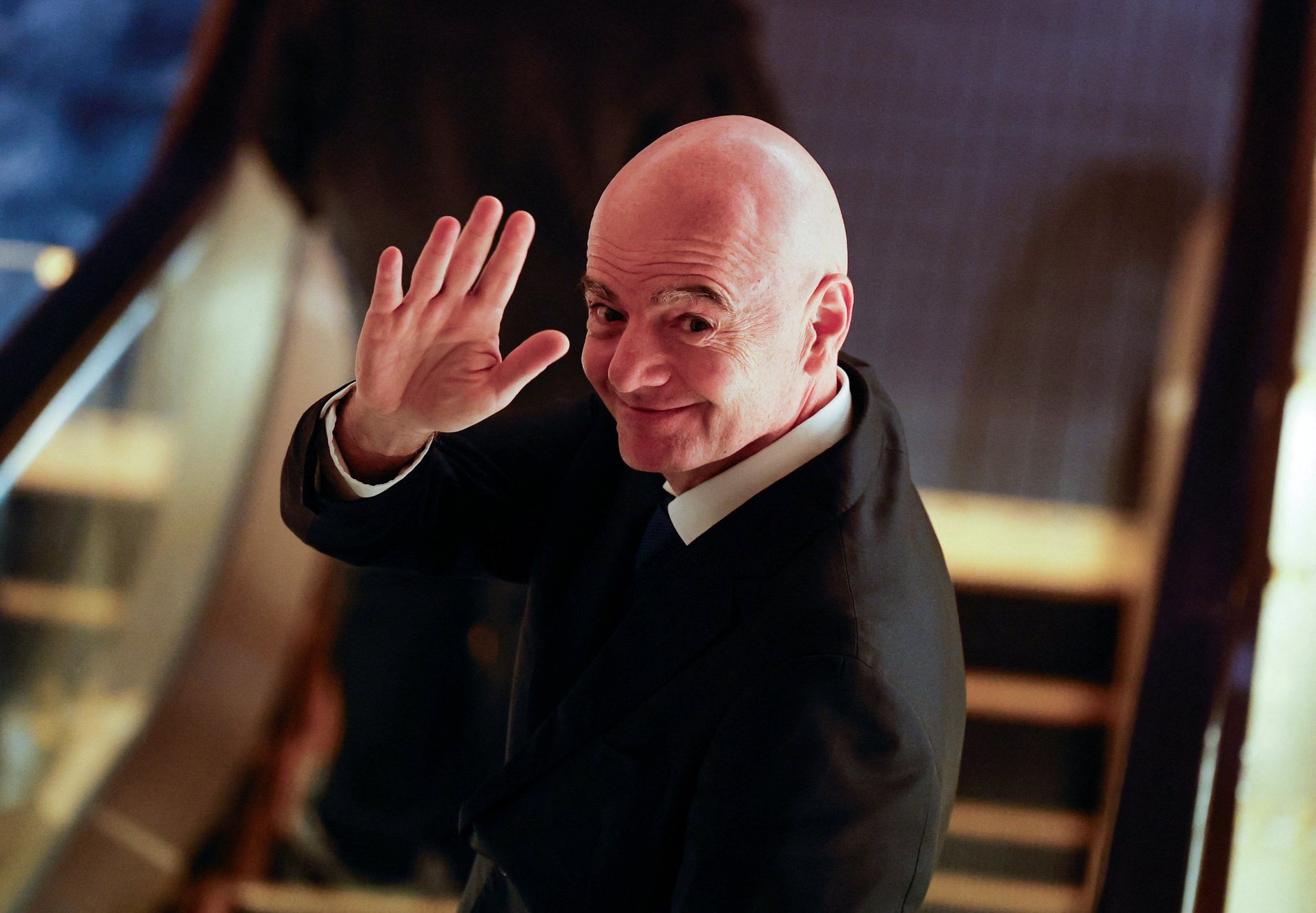 FIFA president Gianni Infantino gestures to reporters as he leaves from a venue for the Asian Football Confederation (AFC)'s extraordinary congress in Tokyo