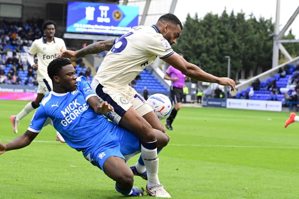 Bolu Shofowoke of Posh battles with Curtis Tilt of Burton Albion. Photo David Lowndes.