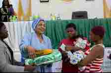 The Wife of Abia Governor, Mrs Priscilla Otti presenting some items to rural women during campaign against Malaria