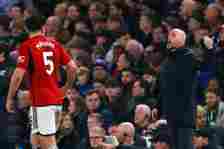 Erik ten Hag Manager/Head Coach of Manchester United with Harry Maguire during the Premier League match between Chelsea FC and Manchester United at...