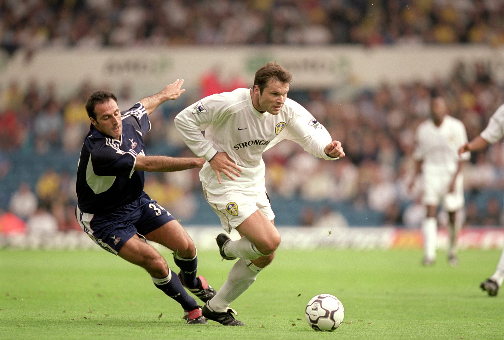 30 Sep 2000:  Mark Viduka of Leeds United beats Ramon Vega of Tottenham during the FA Carling Premiership match at Elland Road, in Leeds, England. ...