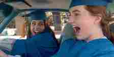 Amy (Kaitlyn Dever) and Molly (Beanie Feldstein) drive to graduation in Booksmart.