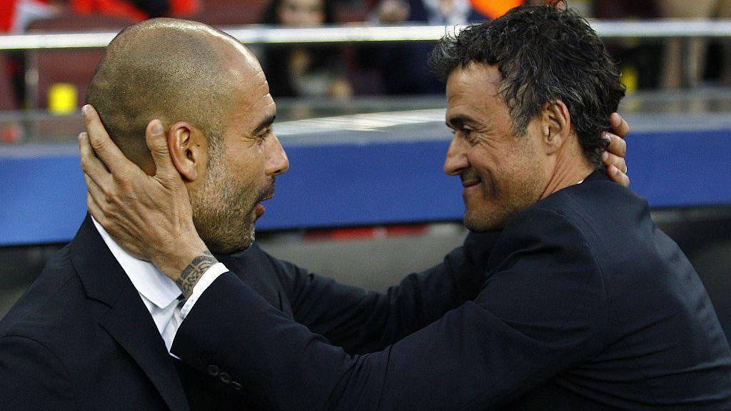Pep Guardiola and Luis Enrique embrace during a Champions League meeting between Bayern Munich and Barcelona in 2015