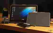 Wacom drawing tablets propped up on a desk next to phones, one shows Samsung DeX