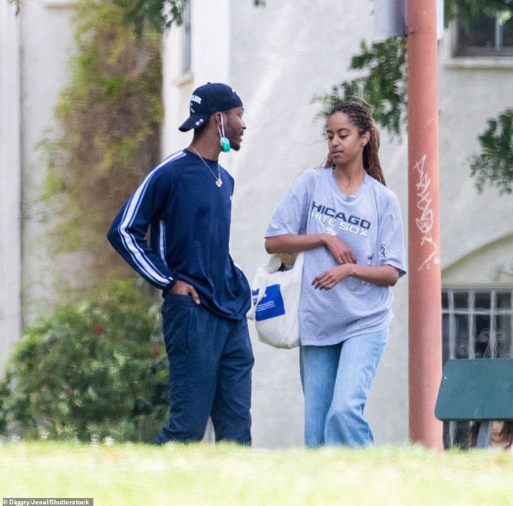 The duo looked very relaxed and comfortable around one another as they walked through the park, before coming to a rest at a bench, where Malia smoked a cigarette while Clifton remained standing.