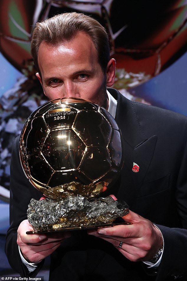 England captain Kane plants a kiss on the trophy after being crowned the world's best player