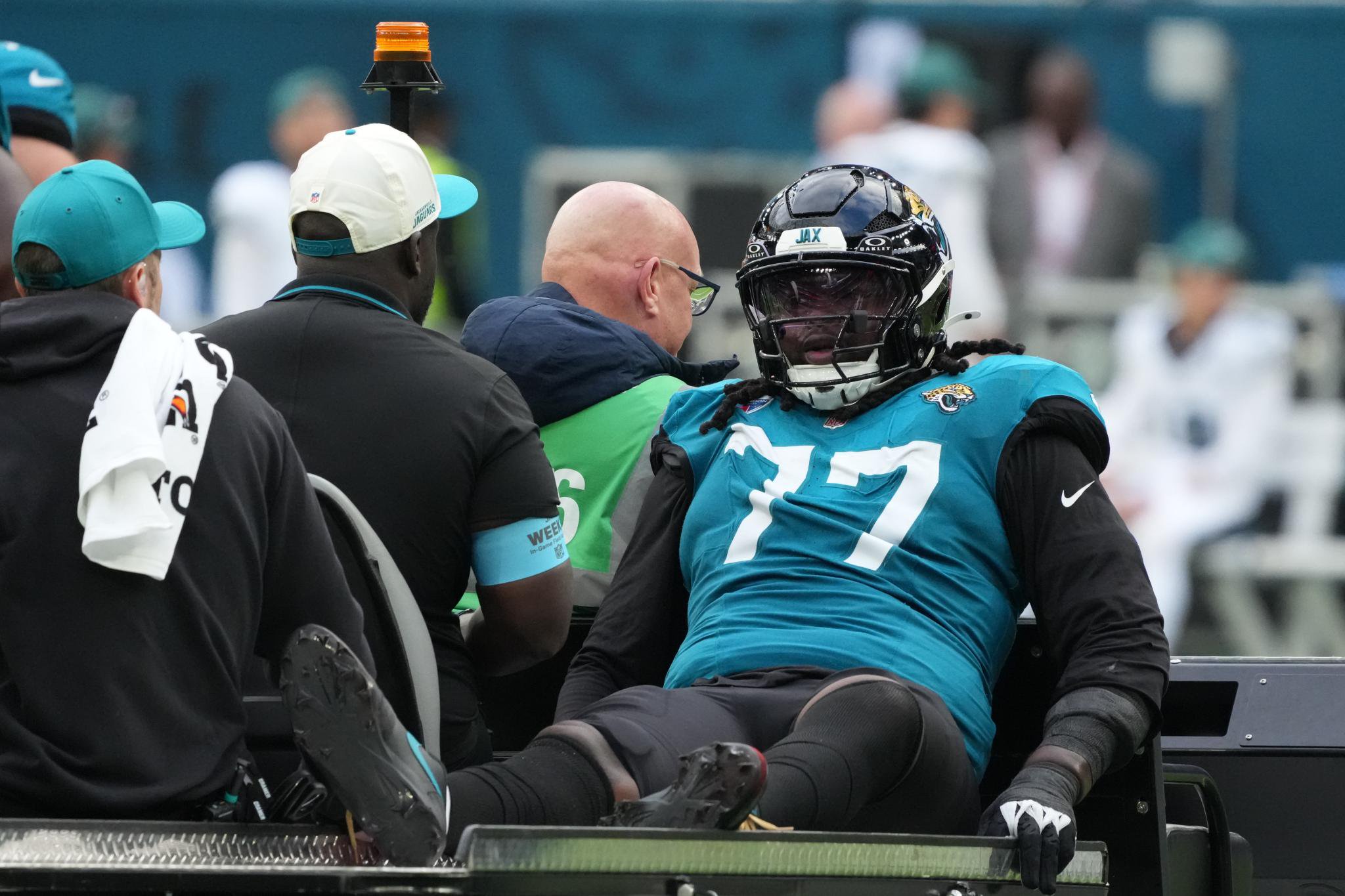 Jacksonville Jaguars offensive lineman Anton Harrison is carted off the field after an injury during a game against the Philadelphia Eagles.