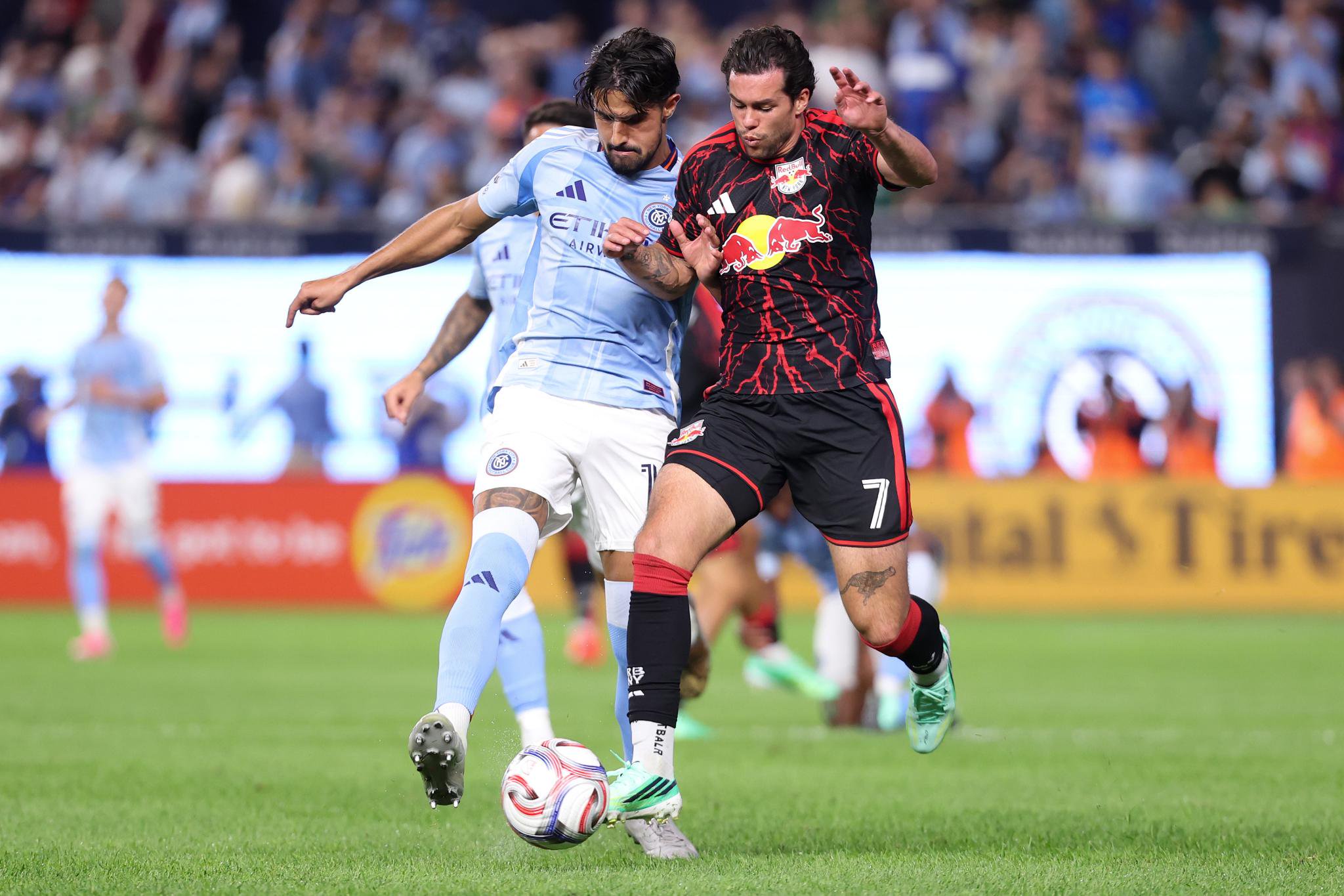Cade Cowell #7 of the New York Red Bulls and Thiago Martins #13 of New York City Football Club battle for possession during the second half at Yankee Stadium on September 18, 2026.