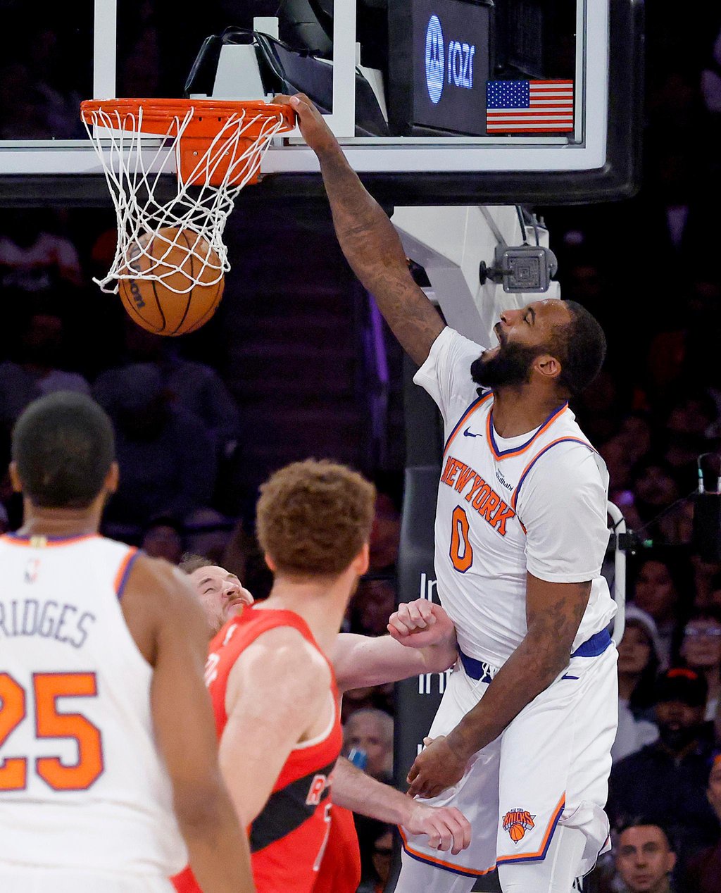 New York Knicks center Andre Drummond slams the ball through the hoop against the Toronto Raptors.