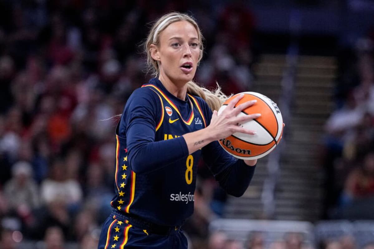 Indiana Fever guard Sophie Cunningham holds the basketball during a game