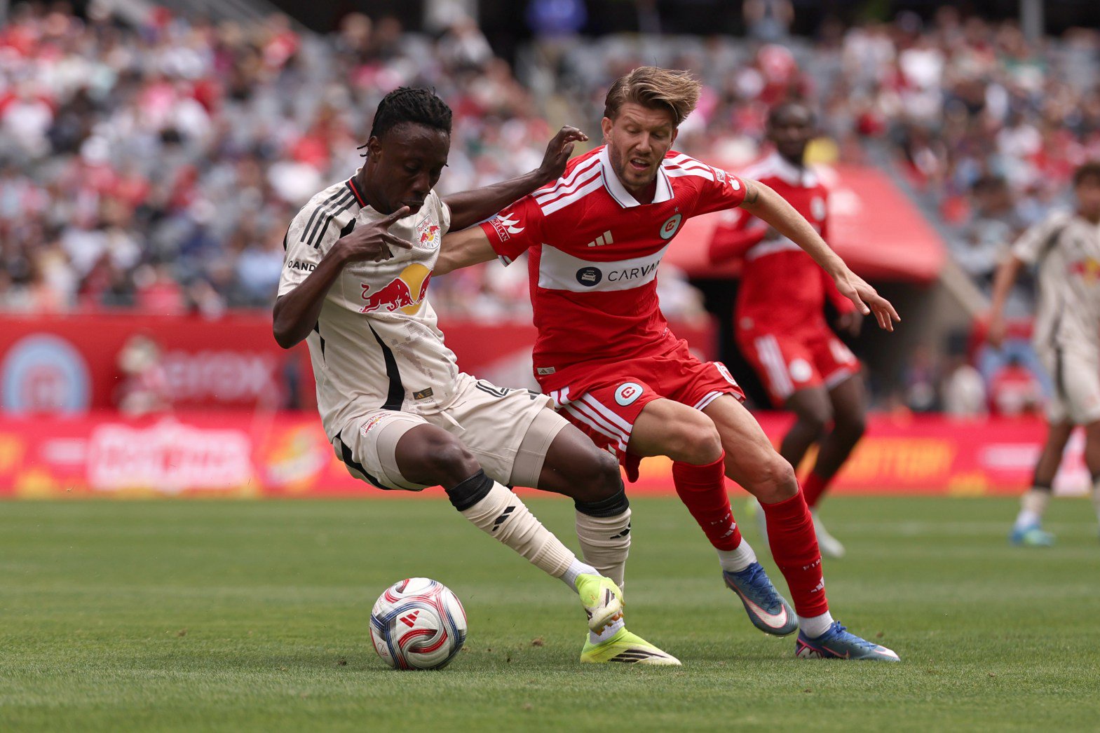 Fire midfielder Anton Salétros, right, defends the Red Bulls' Ronald Donkor during the first half on May 9, 2026, at Soldier Field. (Geoff Stellfox/Getty)