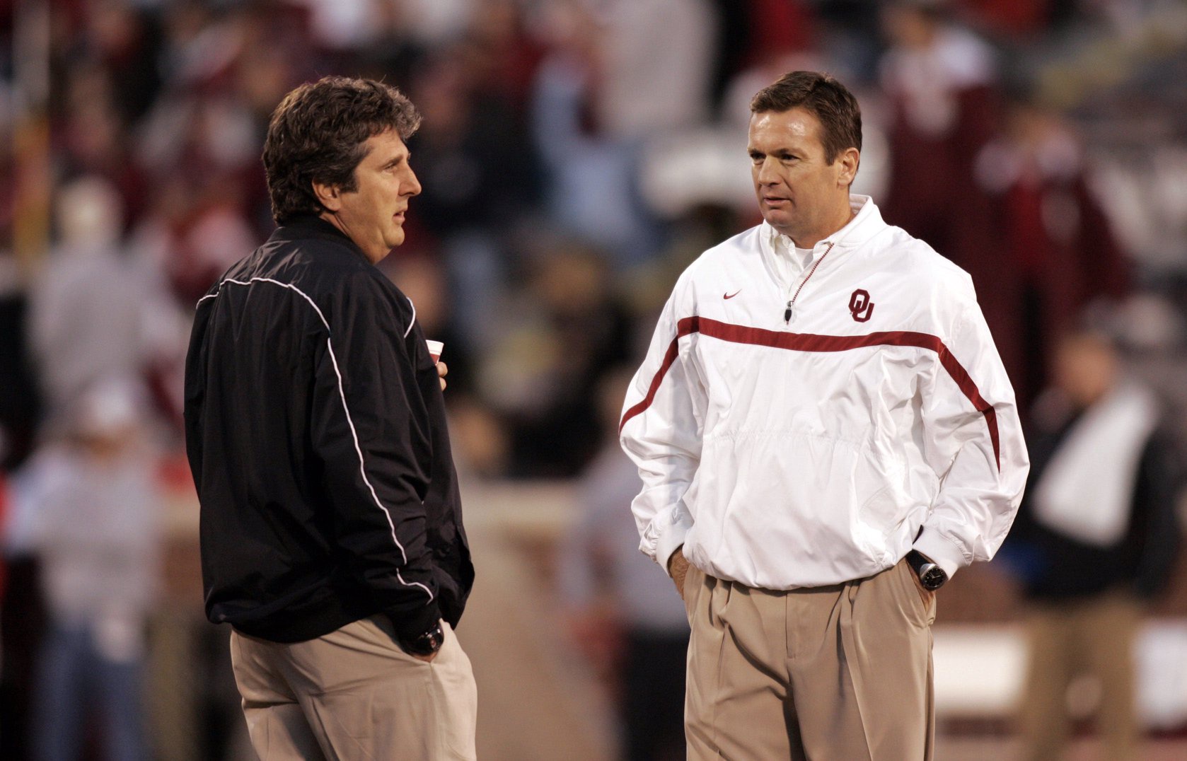 Nov 11, 2006; Norman, OK USA; Oklahoma Sooners head coach Bob Stoops talks with Texas Tech head coach Mike Leach before the game at Oklahoma Memorial Stadium. Mandatory Credit: Photo by Tim Heitman-USA TODAY Sports(c) Copyright 2006 Tim Heitman