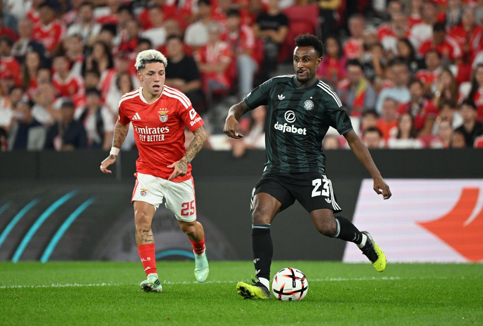 Celtic's Haissem Hassan battles Benfica's Gianluca Prestianni for the ball at the Estadio da Luz