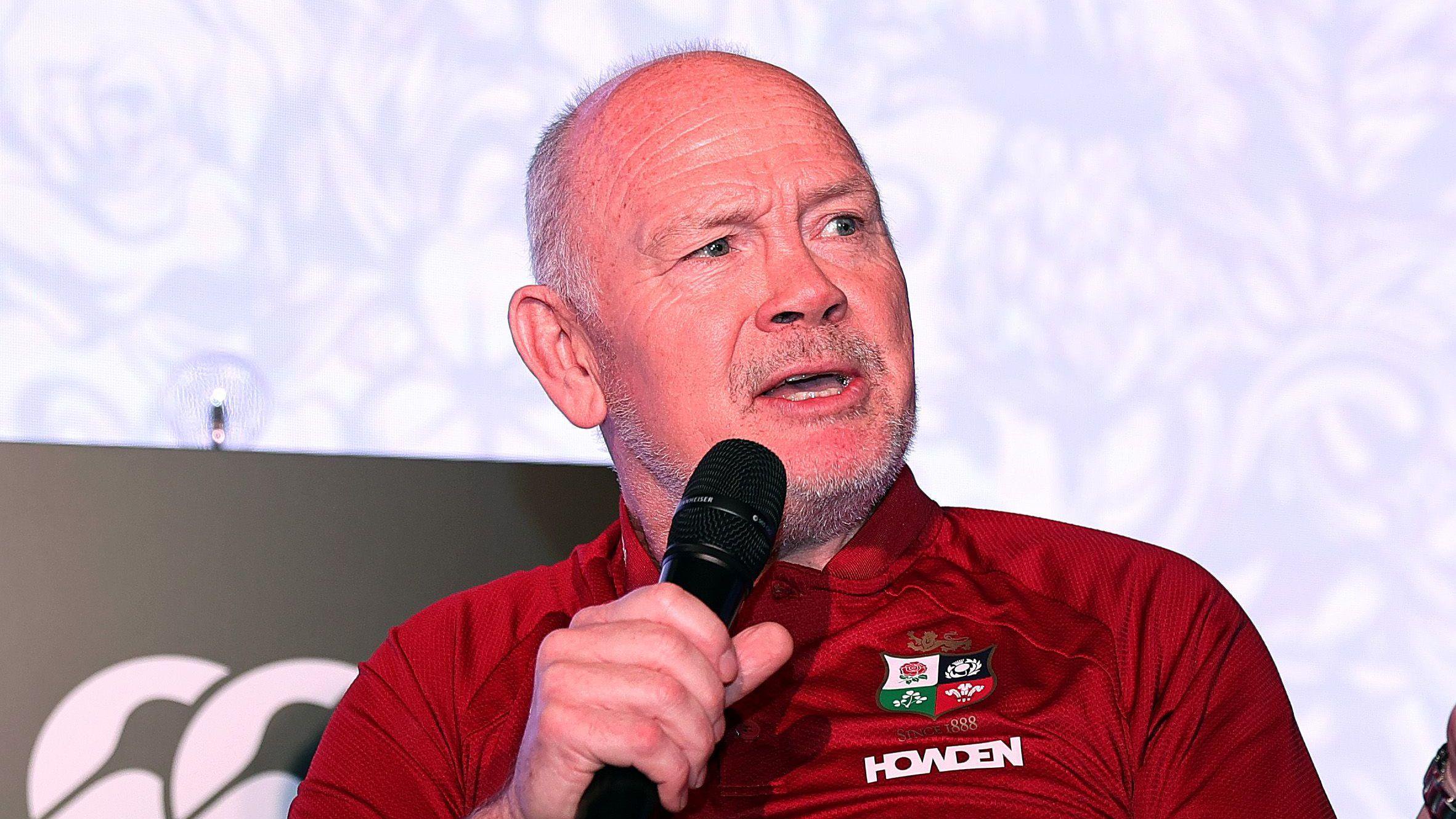 Lions chair Ieuan Evans speaks into a microphone