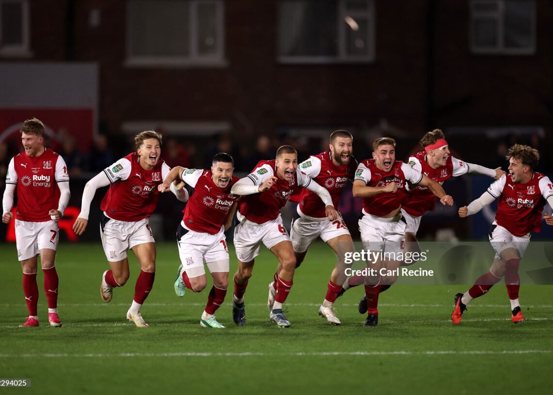 Fleetwood Town players celebrate after Jay Lynch of Fleetwood Town saves a penalty from Bruno Guimaraes of Arsenal to win the match during the Carabao Cup Fourth Round match between Fleetwood Town and Arsenal (Photo by Carl Recine/Getty Images)