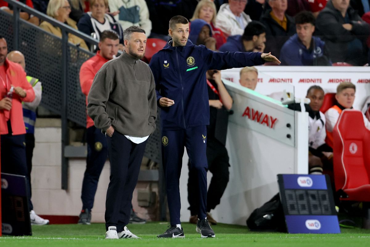 Kim Hellberg, head coach of Middlesbrough chats with coach David Selini