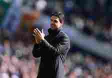 A smiling Mikel Arteta the head coach / manager of Arsenal applauds the fans after the Premier League match between Tottenham Hotspur and Arsenal F...