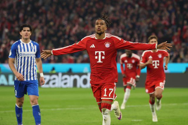 Michael Olise celebrating his goal against Magdeburg.