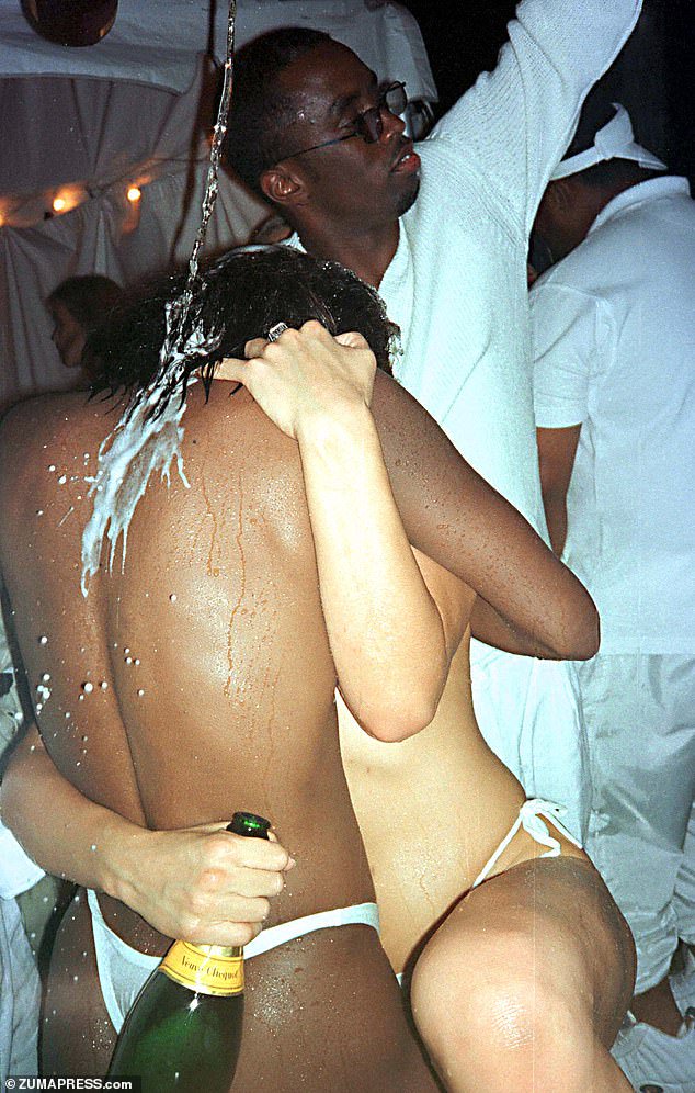 Diddy seen pouring champagne over two attendees at a party in 1998