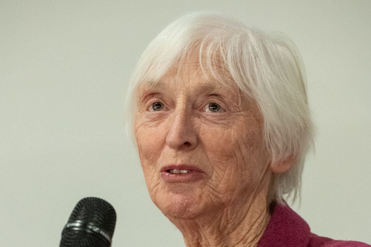 An image of Baroness Sue Campbell holding a microphone from the England Netball turning 100 event on 12 February 2025 at Heritage Quay, Huddersfield, West Yorkshire.