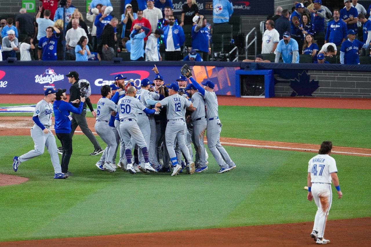 TORONTO, ON - November 1 World Series Game Seven, Addison Barger (47) of the Toronto Blue Jays walks off the field as The Los Angeles Dodgers run onto the field to celebrate winning the World Series against Toronto Blue Jays at the Rogers Centre in Toronto, November 1 2025. (Photo by Arlyn McAdorey/Toronto Star via Getty Images)