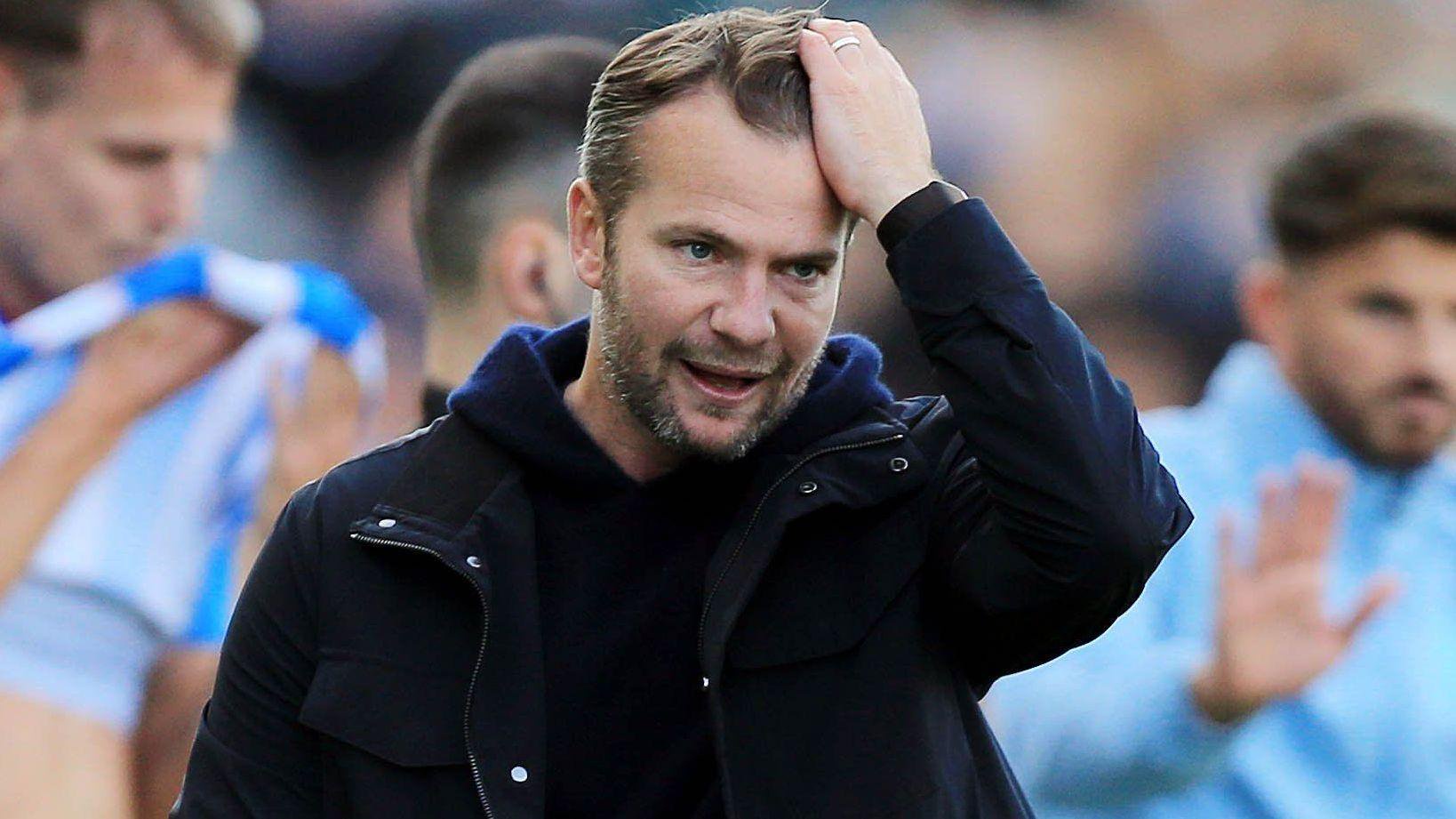 Tom Cleverley runs his hand through his hair in frustration